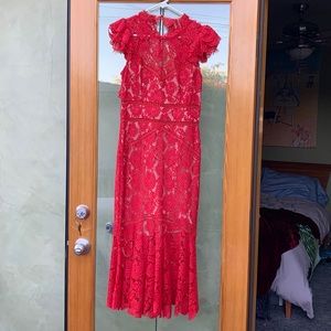 Red lace dress, lined to the knees, open back, buttons behind the neck, size S